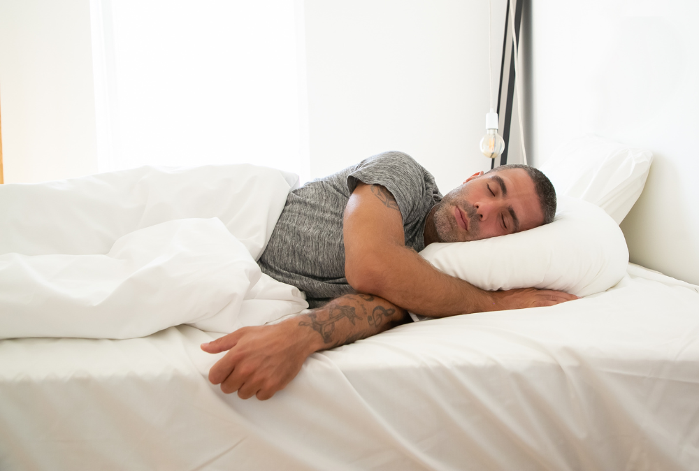 man sleeping in bed, sleep apnea treatment, obstructive sleep apnea